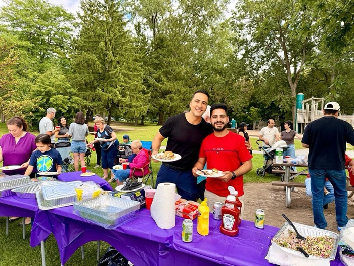 Mert and a client at the barbecue table