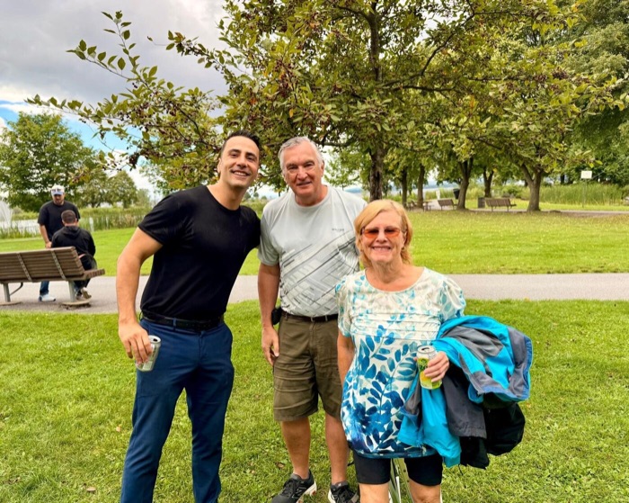 Mert with two clients by the water