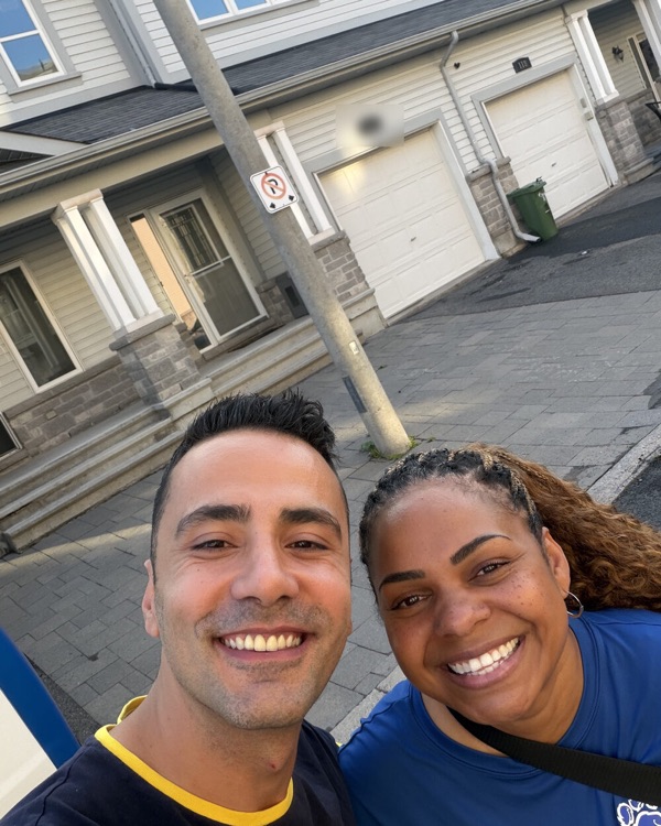 Mert with a buyer on the street of her new townhome