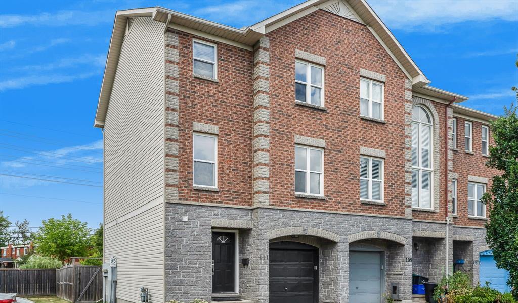 Front exterior of 111 Arcola Private, an end-unit townhome in Overbrook, Ottawa