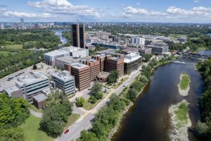 Aerial view of Carleton University beside the Rideau River
