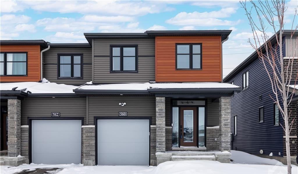 Front exterior of 560 Prominence Way, an end-unit townhome in Orleans, Ottawa