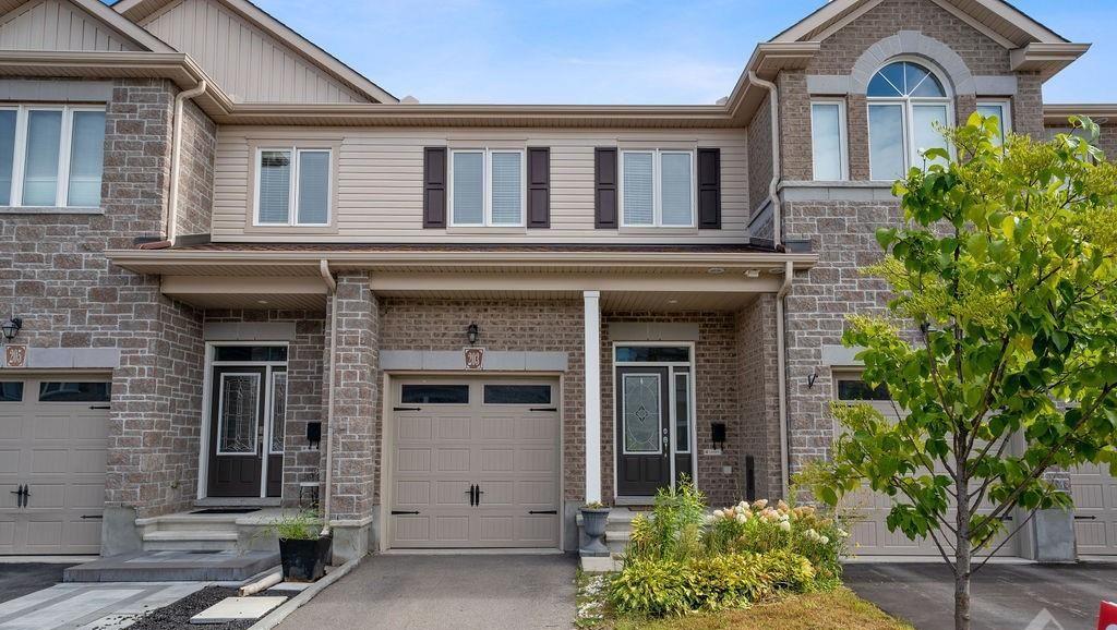 Front exterior of 203 Sittelle, a townhome in Fallingbrook, Orleans, Ottawa